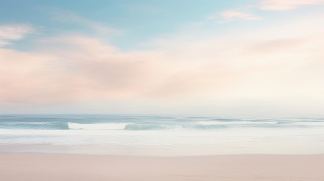 A beach with a pastel colored sky and the ocean in the background.