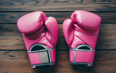 pink boxing gloves, symbol of the fight against breast cancer. the power of women