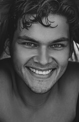 black and white portrait of a guy with a beautiful smile
