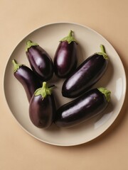 fresh eggplants on beige background