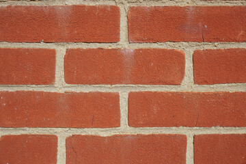 Red brick wall background. Solid textured surface. Bricks and mortar 