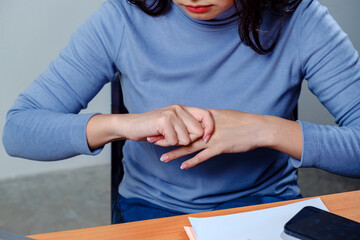 employee woman massage on his hand and arm for relief pain from hard working for stiff or office syndrome concept