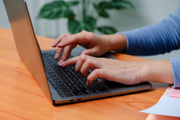 woman hands writes on laptop. Entrepreneur woman sit at desk work on modern wireless notebook, do remote telecommute, search information on internet, professional application usage concept