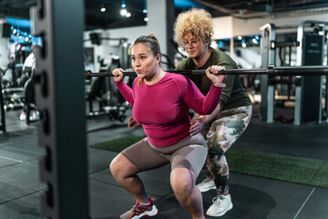 	
Two beautiful, overweight women push their limits during a workout, supporting each other every step.	
 - obrazy, fototapety, plakaty