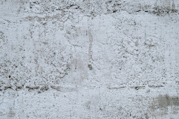 Gray stained concrete wall, dirty cracked cement surface close-up. Photography, abstraction, background.