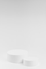 Abstract white stage with two round podiums mockup. Template for presentation cosmetic products, goods, advertising, design, sale, text, display, showing in cold winter style.