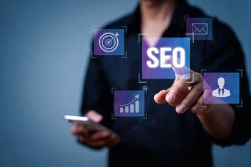 Search engine optimization marketing ranking. Working on computer with the icon of online search engine, abbreviation SEO and SEO symbol. Digital marketing strategy of promote traffic to website - obrazy, fototapety, plakaty