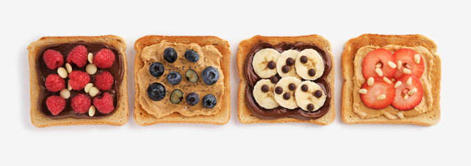 Sweet toasts with raspberries, banana, strawberries, blueberries on light background. Flatly.