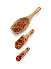 Spice in wooden spoons isolated on white background