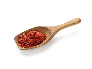 Crushed red pepper in wooden spoon isolated on white background