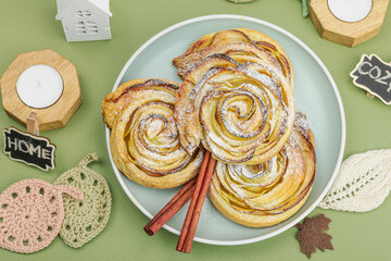 Apple roses pie with sugar powder. Traditional autumn baking, fall decor, flat lay