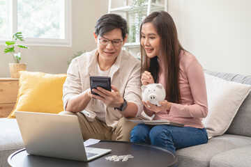 financial in family concept, Happy Asian husband and wife calculating income and bills to plan for investment. - obrazy, fototapety, plakaty