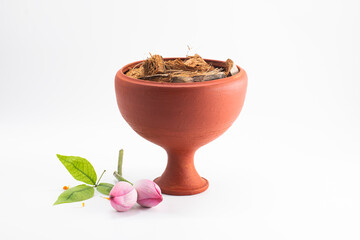 DURGA PUJA DECORATIVE DHUNUCHI WITH LOTUS ISOLATED ON WHITE BACKGROUND.