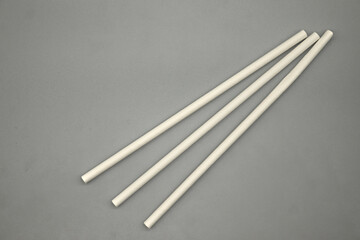 paper drinking straws on gray background