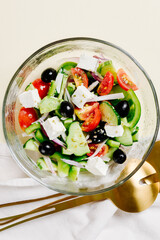 Classic Greek salad in a glass bowl.