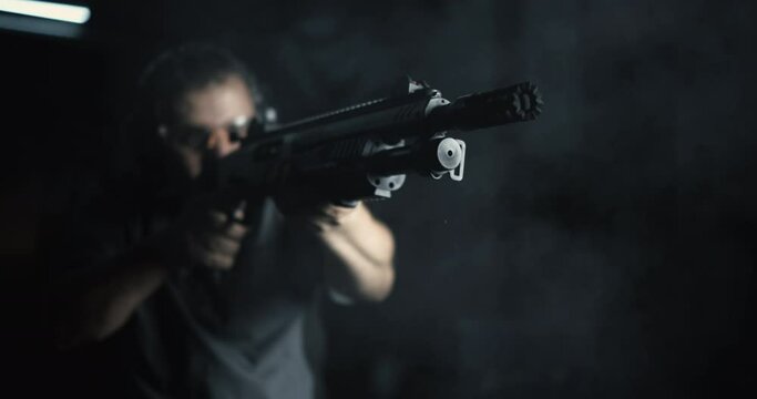 Front View of Man Firing Shotgun, 800fps Super Slow-Motion, High-Speed Powerful Weapon Shooting