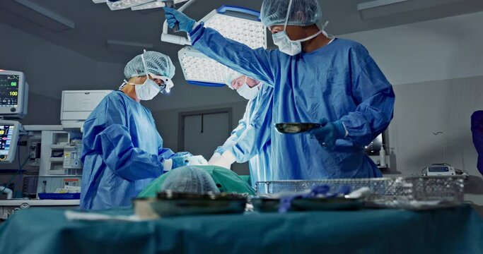 Doctors, teamwork and surgery in theater with medical support for healthcare, safety and operation at hospital. Surgeon, medicine and team or collaboration with tools for cardiology or emergency