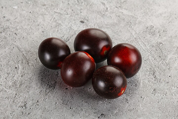 Raw ripe black kumato tomato