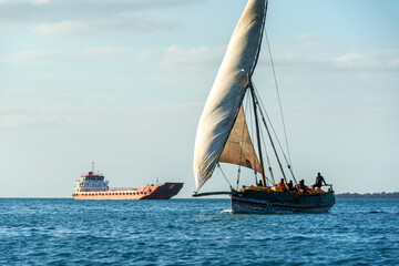 seafarers on a dhow the traditional sailing vesssels of zanzibar tanzania - obrazy, fototapety, plakaty