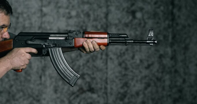 High-Speed 800fps Slow-Motion Shooting with AK-47, Side View of Man Aiming and Firing Kalashnikov Rifle