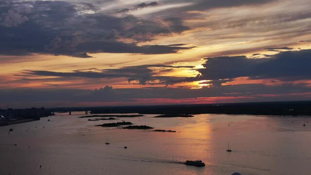 Time lapse View of Sunset with Ships and Boats Traffic on River at Dusk