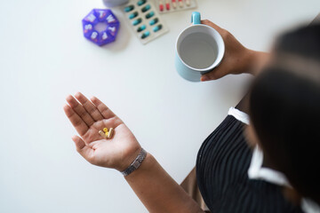 Close up woman holding pill in hand with water feeling sick. female going to take painkiller from headache, painkiller, healthcare, medicine, treatment, therapy, patient, disease illness concept