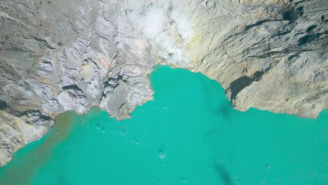 Beautiful view of sulfur emerald lake and Kawah Ijen volcano at East Java, Indonesia. Aerial Drone view 4K.