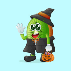kiwi character dressed as a witch and holding a pumpkin