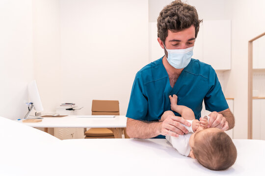 Photo with copy space of a doctor examining a newborn