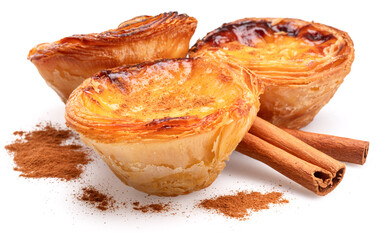 Pastel de nata tarts and cinnamon sticks isolated on white background.