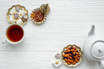 Tea party concept. Traditional Turkish tea with sweets and nuts