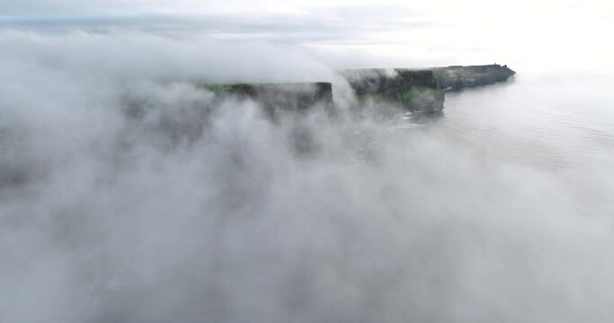 Flying in the misty mystical clouds above the Cliffs of Moher 4k