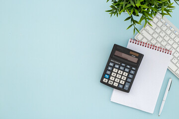 Office table with financial accounting and business planning with calculator