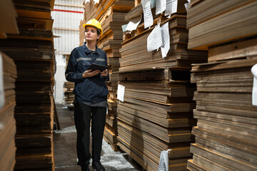 Caucasian businesswoman checking Kraft paper stock	