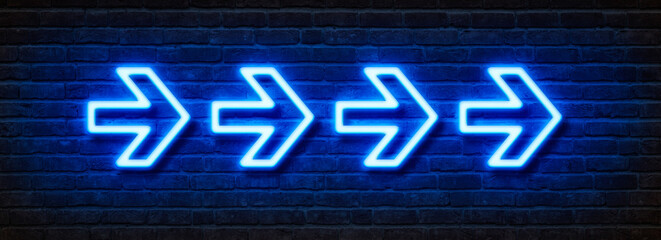 Neon sign on a brick wall - Arrows