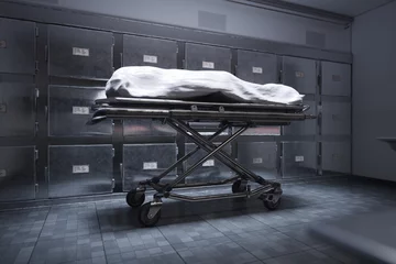 Fotobehang A deceased person lying on a table in a morgue, covered with a white sheet © Dabarti