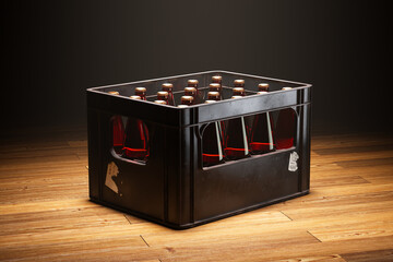 A black crate full of beer bottles standing in a spotlight on a wooden floor.
