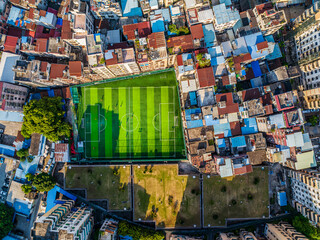 Aerial view of football field in urban residential area, Guangzhou, China.