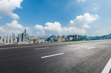Asphalt road highway and urban skyline with modern buildings in Chongqing, China. - obrazy, fototapety, plakaty