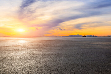 Asphalt road and sea with sky clouds natural landscape at sunrise