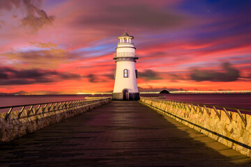 Beautiful lighthouse scenery at sunrise by the sea, Zhuhai, Guangdong Province, China.
