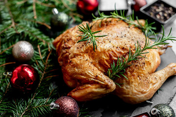 Christmas turkey on the background of a Christmas tree and Christmas decorations. Traditional holiday food for Christmas