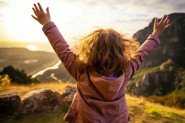 caucasian girl cheering on rural cliffs