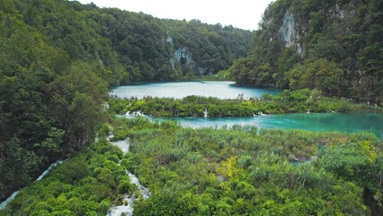 Mountain lake with emerald waters. Largest national park in Croatia. Scenic waterfalls. Plitvice.