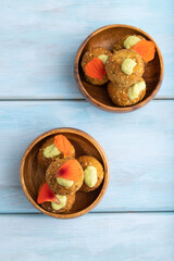 Falafel with guacamole on blue wooden. Top view.