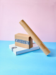 Stack of cardboard parcels packed with zebra patterned tape on colorful background
