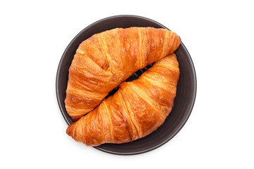 Plate with croissants on a white background. View from above. French pastries
