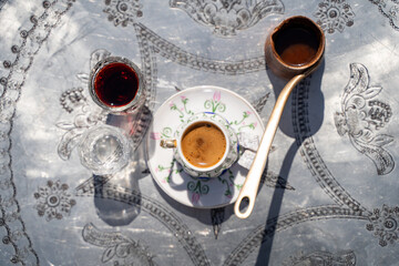 Traditional Turkish coffee, cezve and cup.