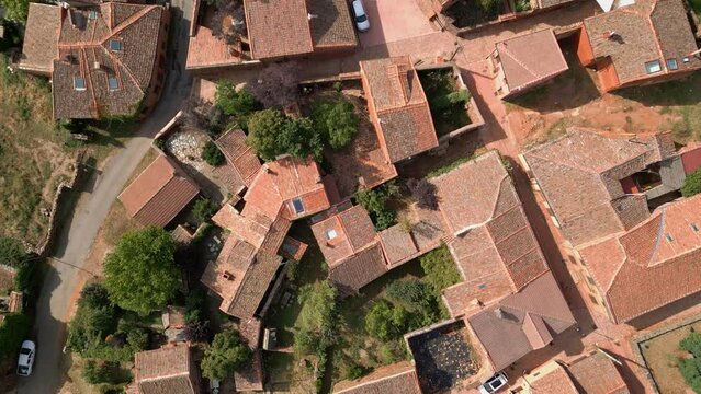 Narrow streets and stone houses of a village of Segovia, drone view, Madriguera, Spain.