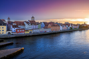 Fototapeta na wymiar Cityscape of Regensburg at the river Daube during sunset